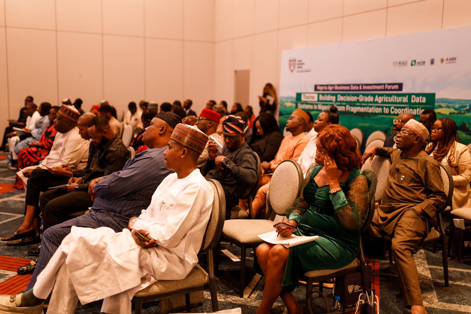 A wide view of the seated audience during a session.